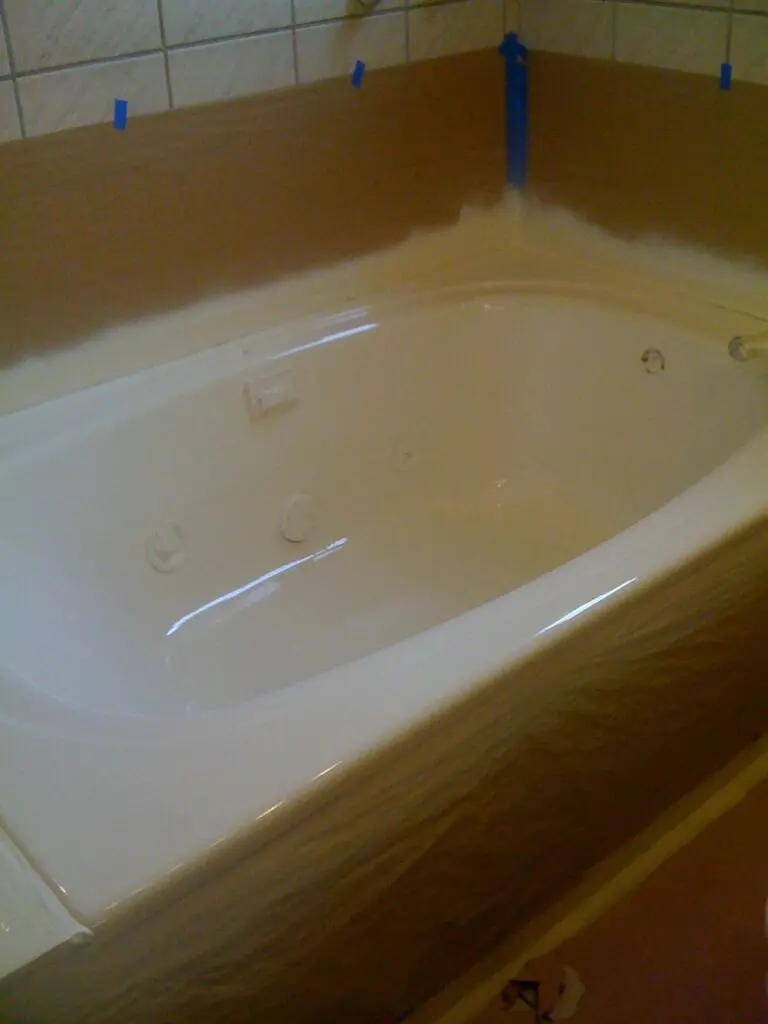 a white porcelain bath tub painted in white