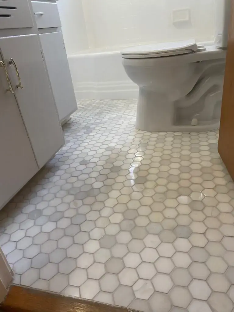 clean hexagonal tiles in a white bathroom